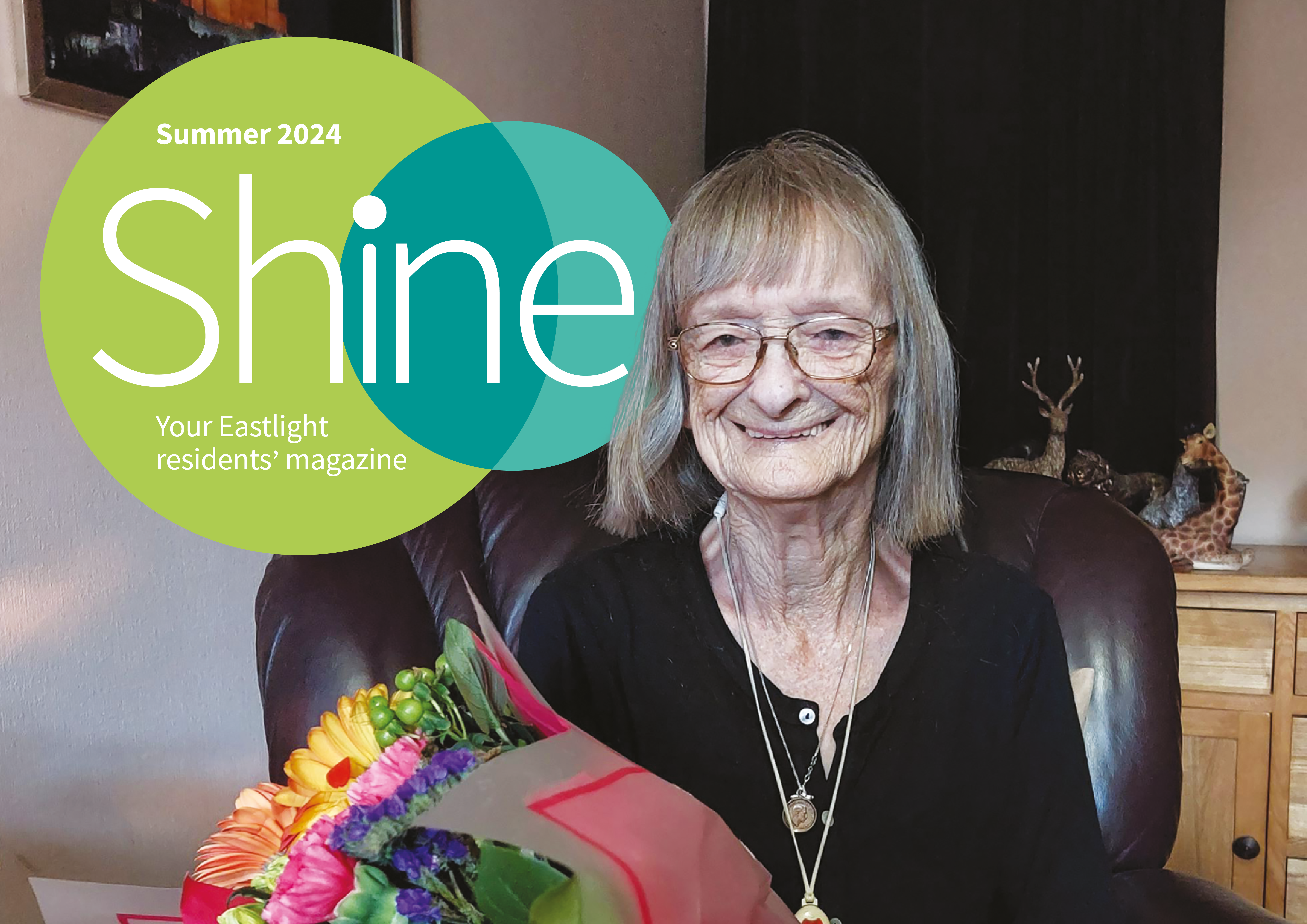 Shine Magazine front page with cover star Val Ahern smiling into the camera whilst holding a bunch of flowers.