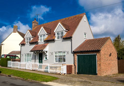 Eastlight home with picket fence