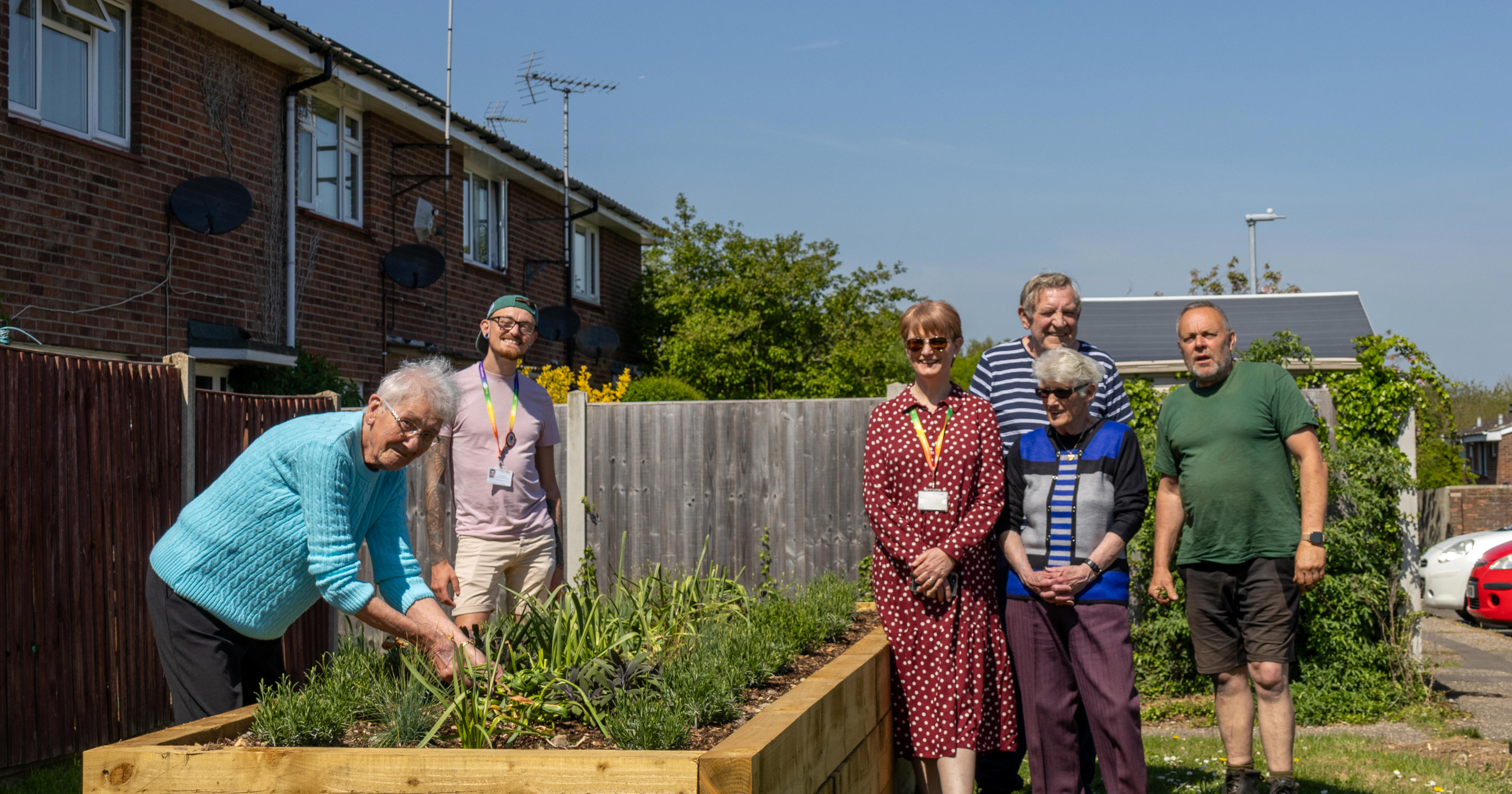 Eastlight's Bobby and Jo are stood with ERG Witham members who have installed a new flowerbed in their community.